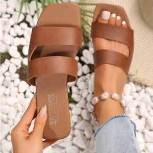 Tan slippers size 8 barely used.